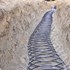 geothermal ground loop laid in a slinky style in a trench
