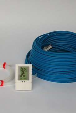 spools of blue coated wire and straps with a digital thermometer