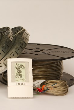 spools of wire and straps with a digital thermometer