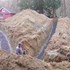 geothermal ground loops being laid in trenches