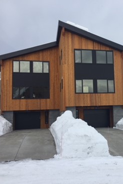 Condominiums with snowmelt system installed under driveway - feet of snow everywhere else but driveway is completely clear