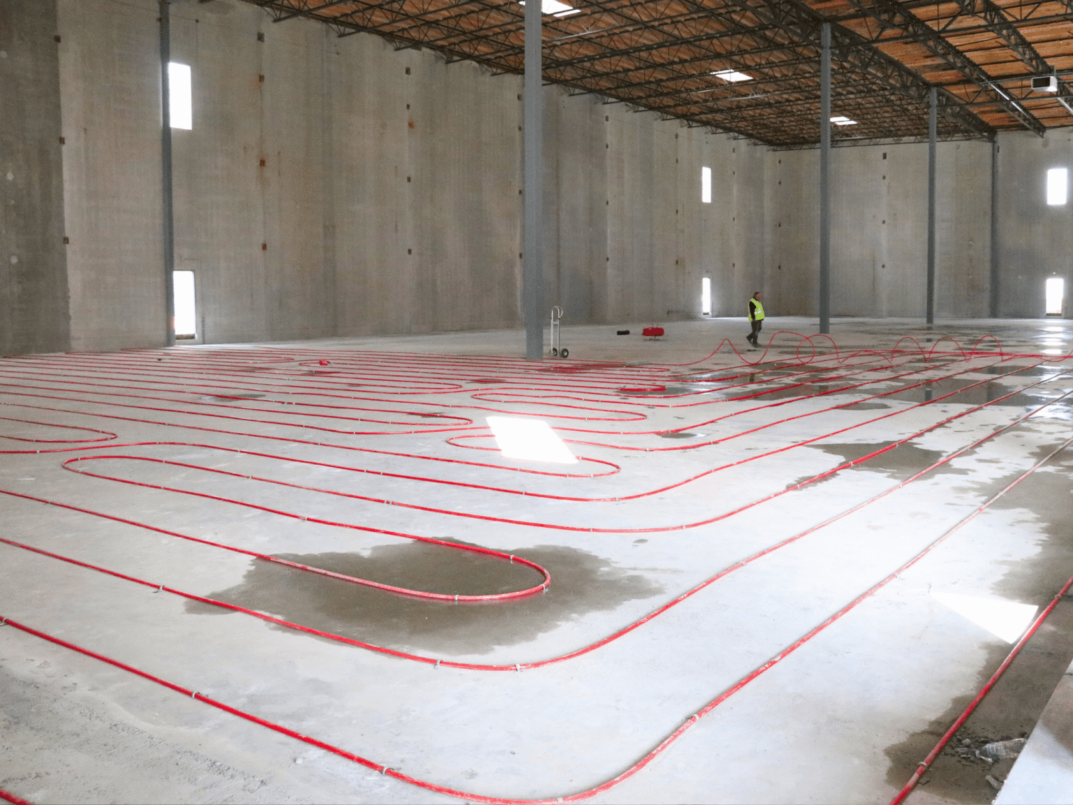 Red pipes laid out over the floor