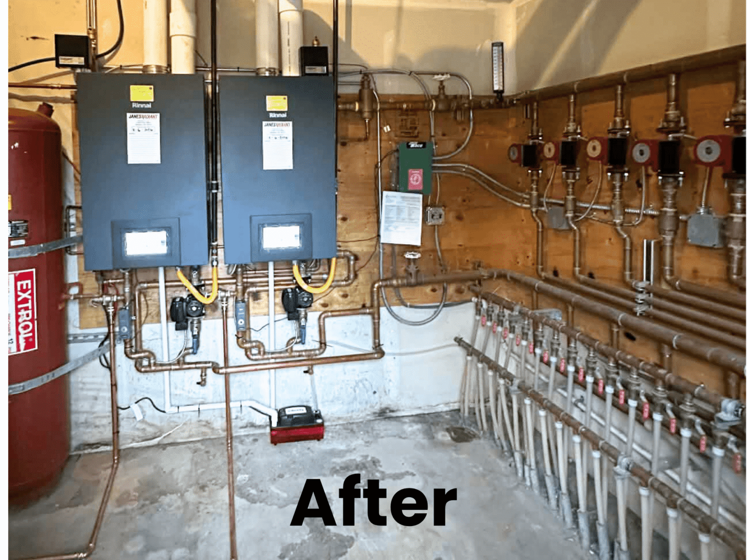 After: Post-installation utility room with two new wall-mounted boilers and an extensive copper pipe radiant manifold system.