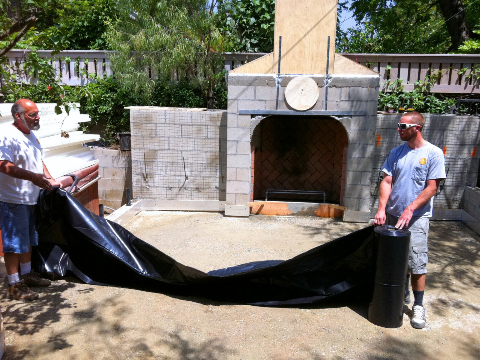 Laying a moisture barrier used for radiant heating