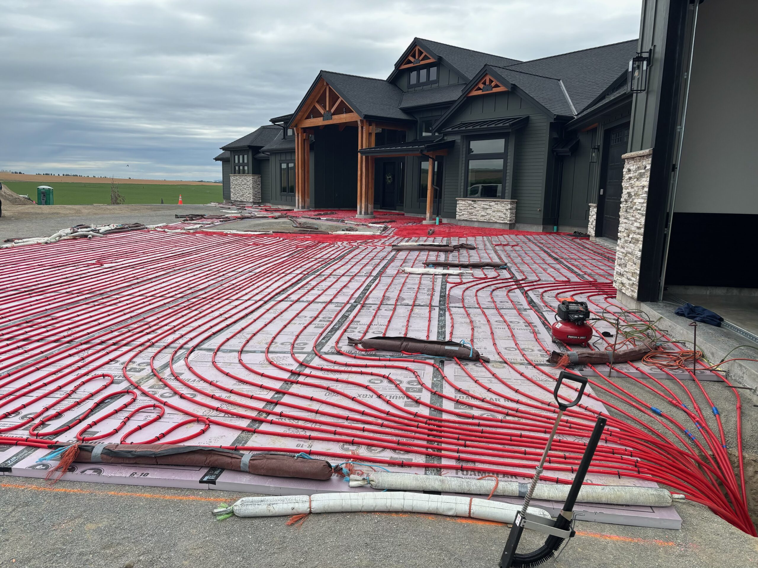 Installation of radiant heating snow melt in the driveway in front of a home is being installed.