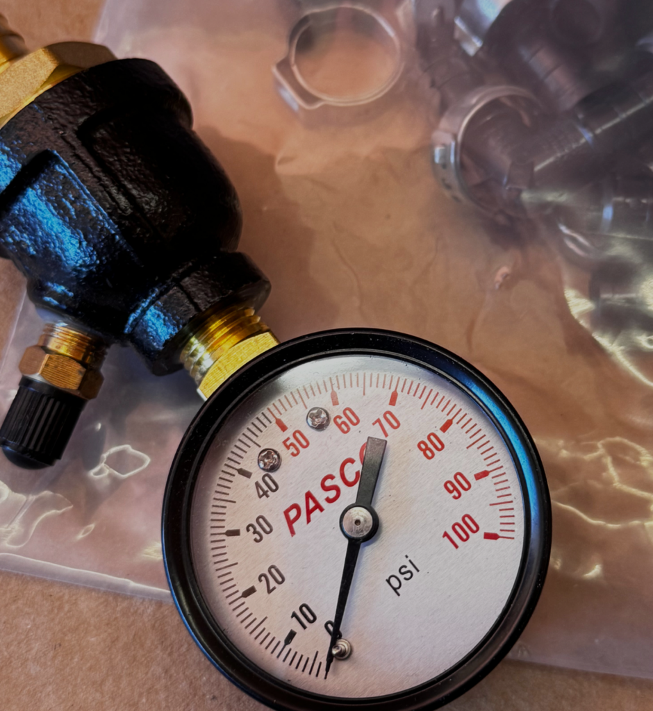Pressure gauge to test pressure on PEX tubing, example of what comes in kit