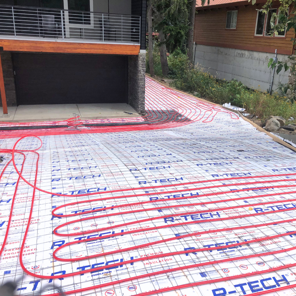 heated driveway installation, pex tubing above installation foam leading to garage
