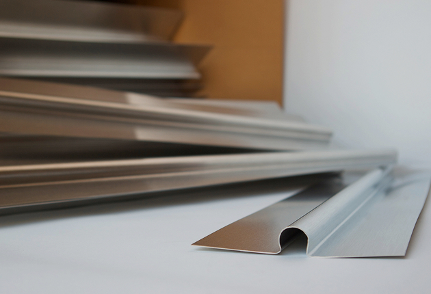Staple up plates that hold tubing under subfloor