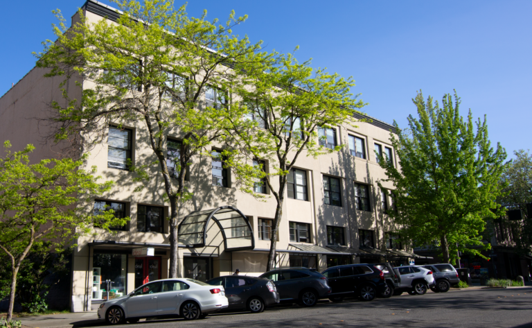 Medium sized 3-story building in downtown Bellingham with apartments on top of storefronts