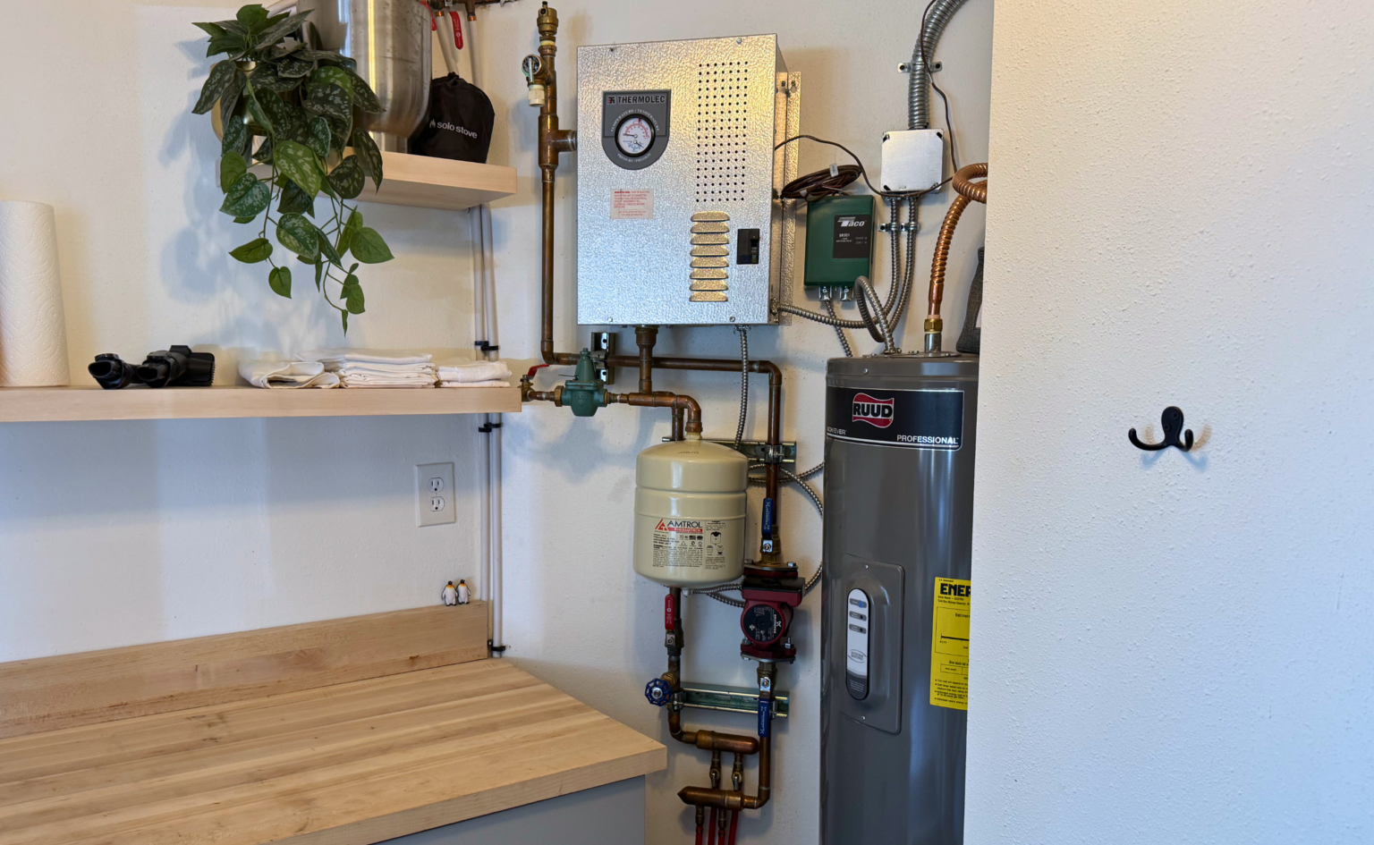 this small electric boiler has 2 loops for a small 200sf cabin with warm floor board paneling system.