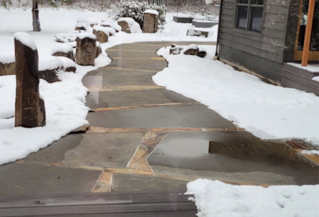 Snowmelt sidewalk for Homeowner; clear sidewalk around home surrounded by snow
