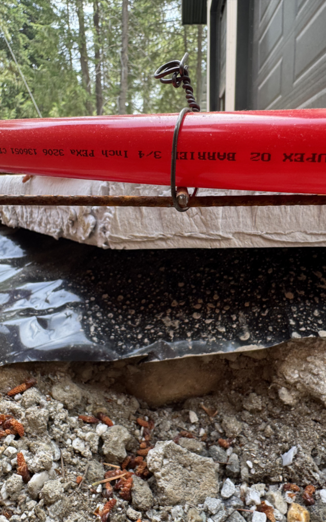 Side view of the layers: Foundation, moisture barrier, insulated foam, wire mesh, and PEX tubing
