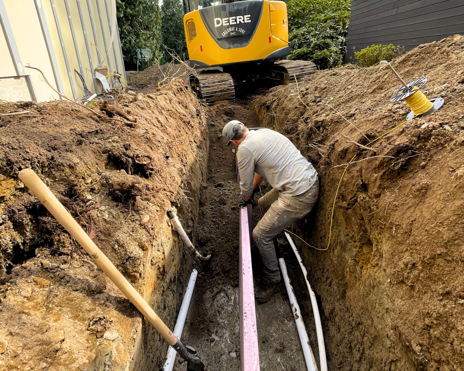 FInalizing trenches for geothermal heating installation