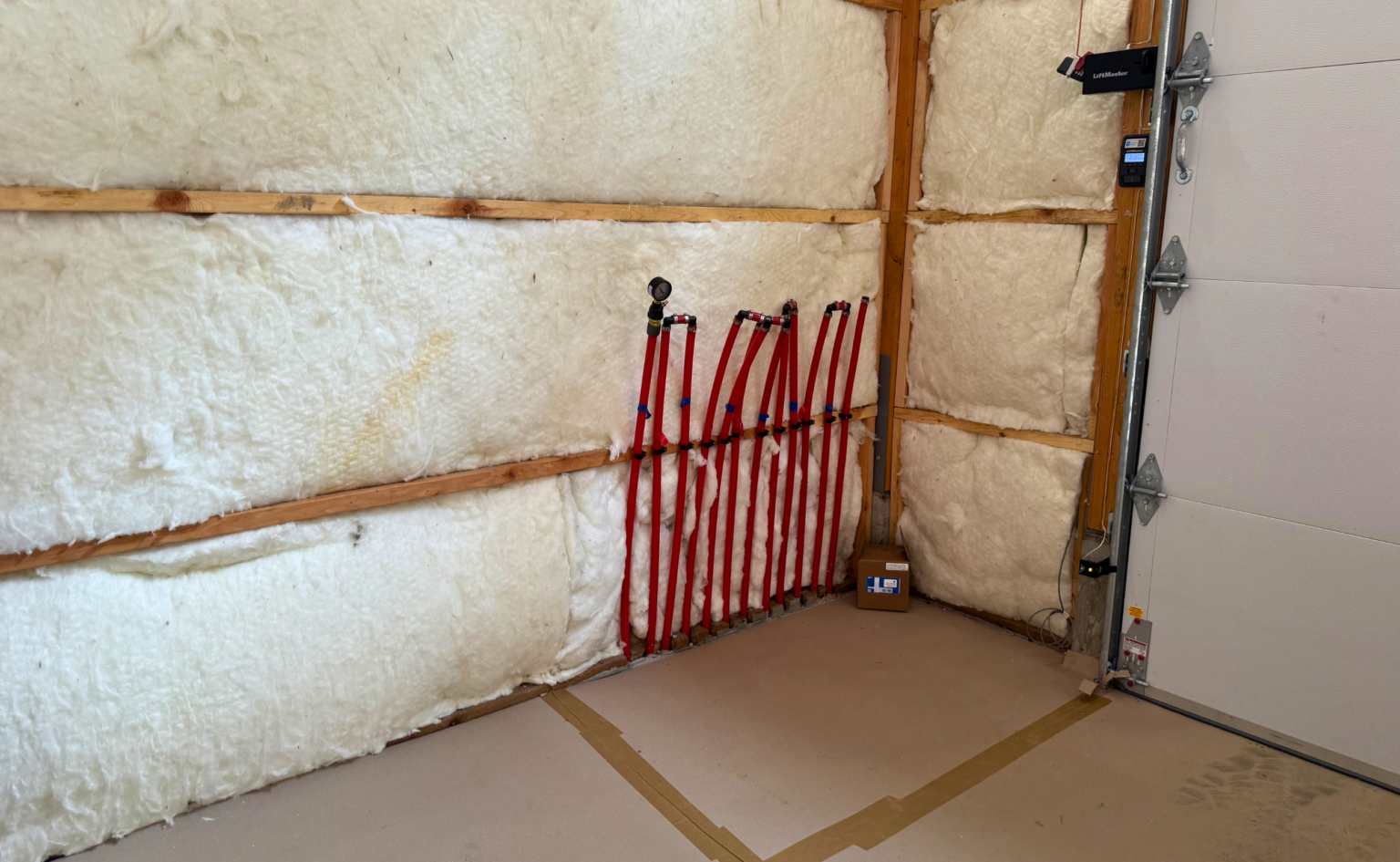 Manifold for snow melt driveway added inside of the shop next to the garage door.