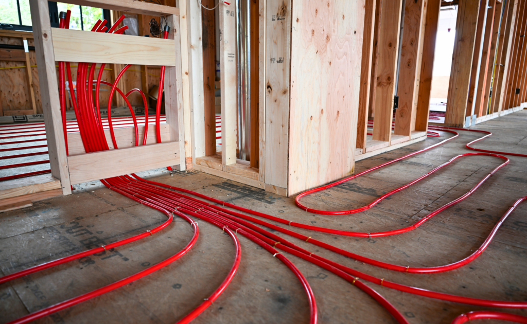 All lines of pex leaving and returning to manifold box