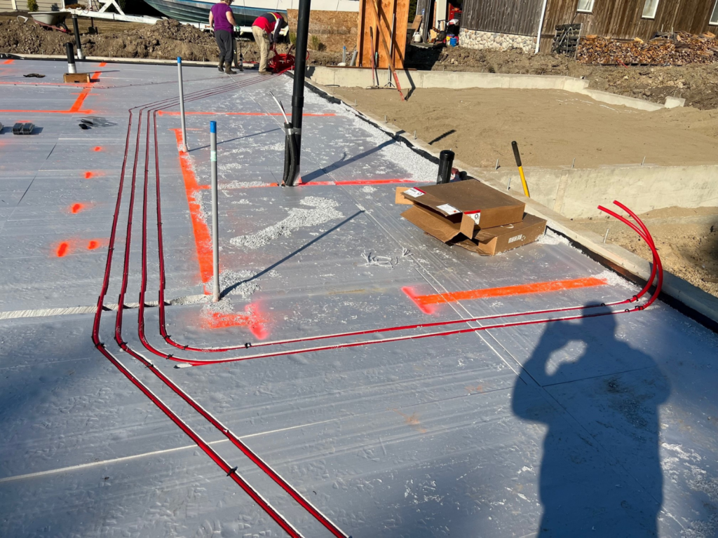 primary supply and return lines carved into foam before loops are laid